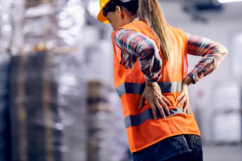 worker with their hands on their back